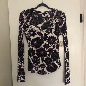 Free People size large new with tags. Beautiful colors.. Snap closure in front